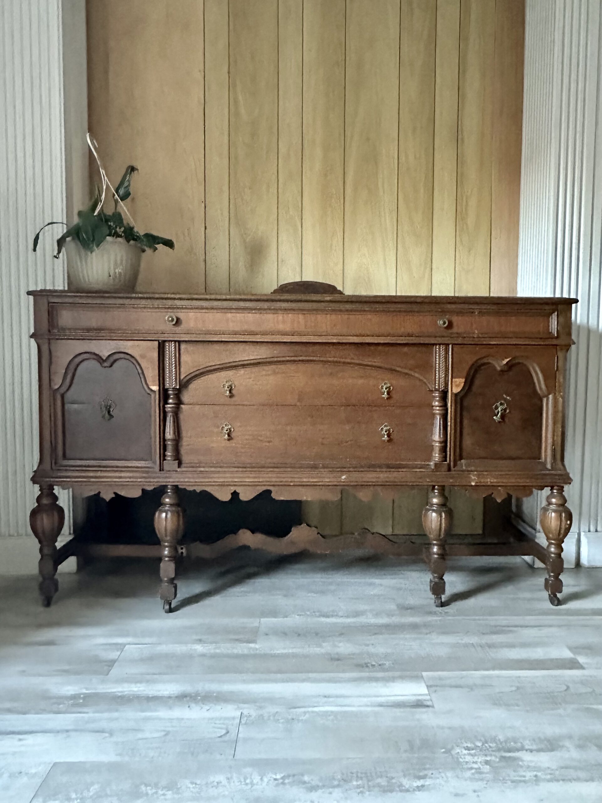 vintage jacobin buffet on a gray floor and wooden background