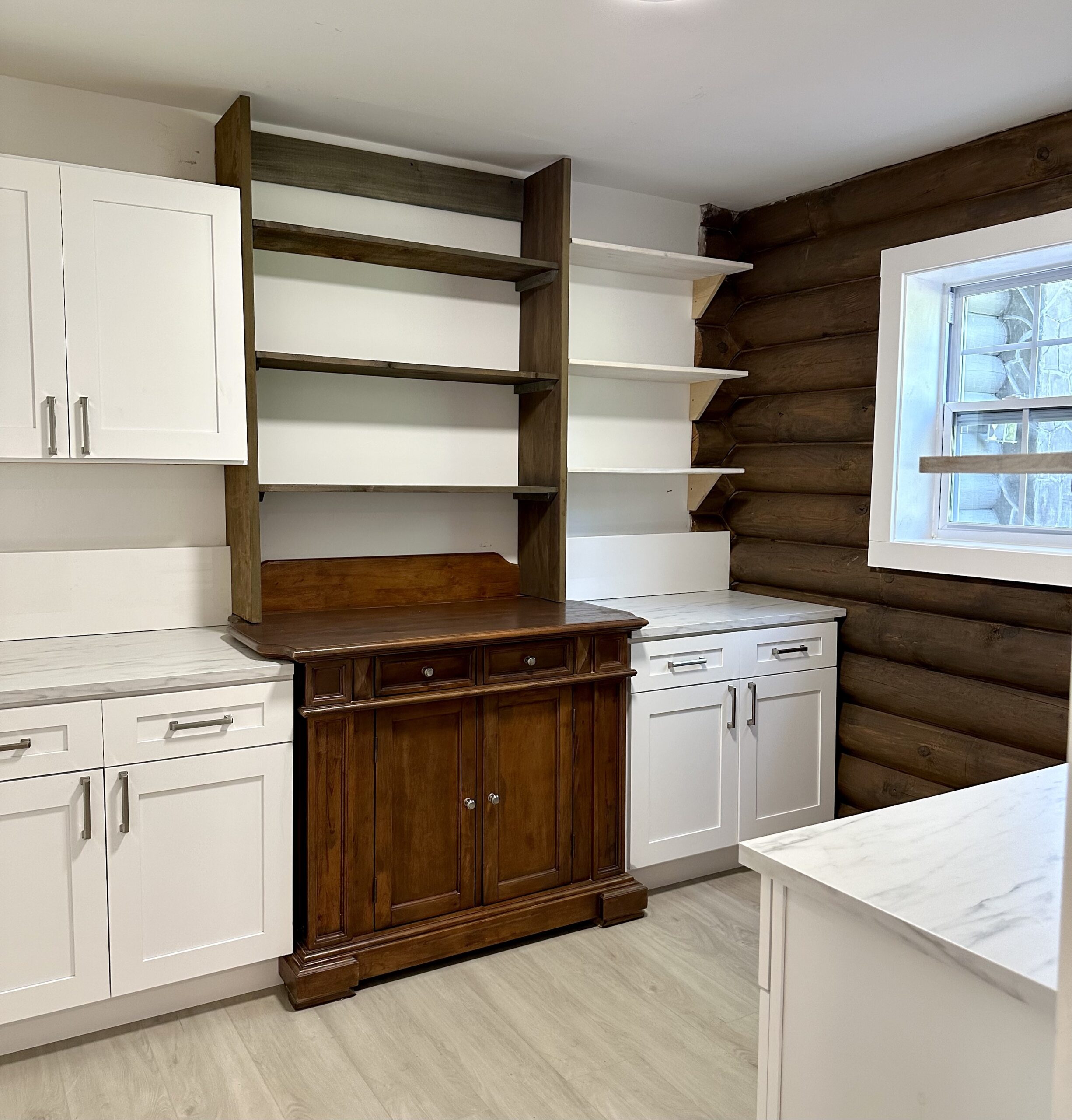 Vintage wooden cabinet incorporated into a modern butlers pantry.